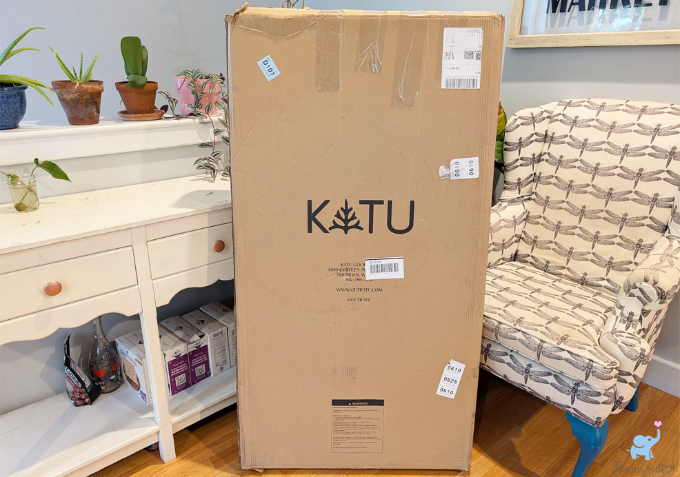 the katu crib mattress in a cardboard box