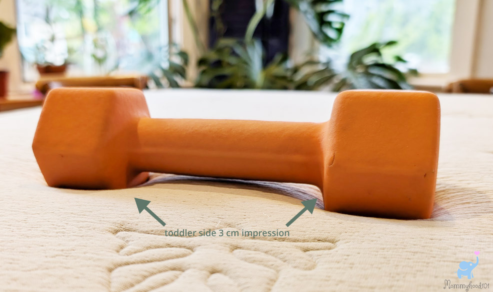 compression testing the katu crib mattress toddler side