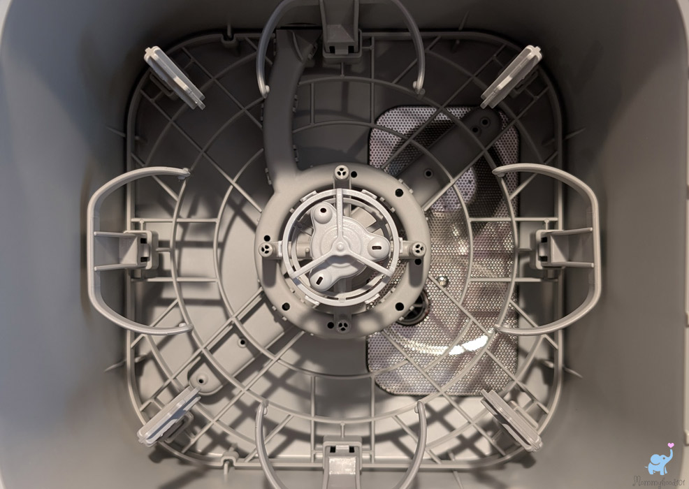 the lower rack of the momcozy bottle washer