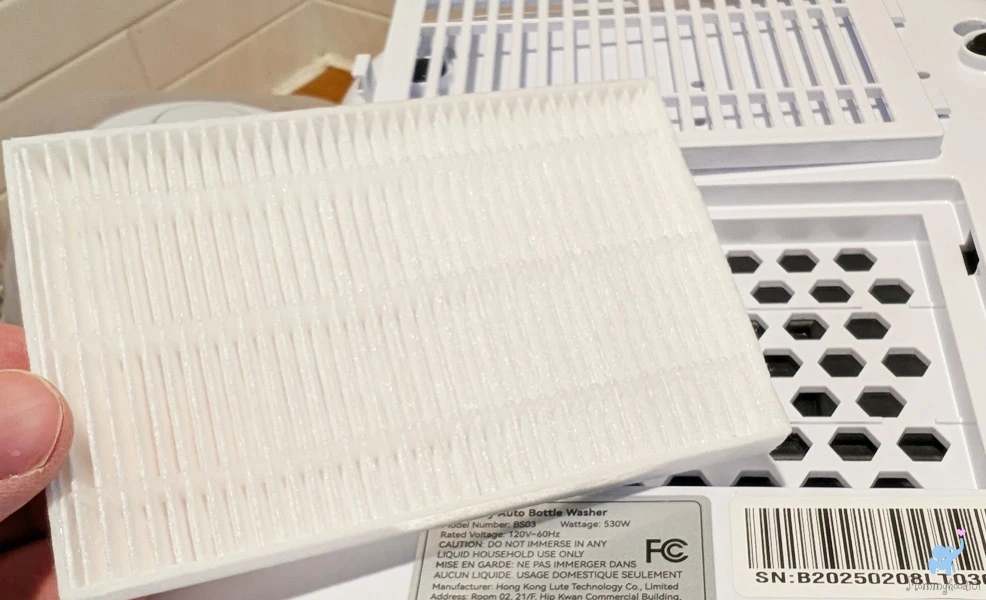 clean baby bottles in the momcozy kleanpal bottle washer pro