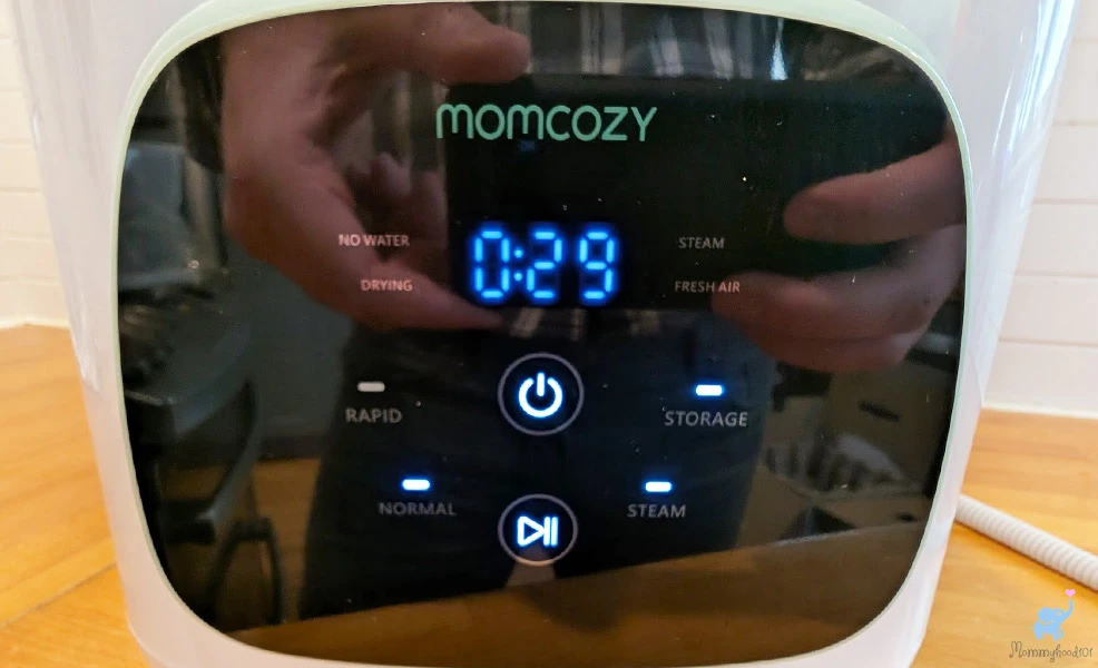 control panel buttons on the momcozy bottle washer